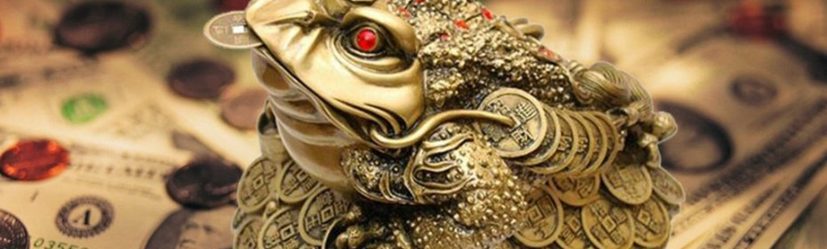 Krupis ar monētu mutē - talismans, lai piesaistītu naudu